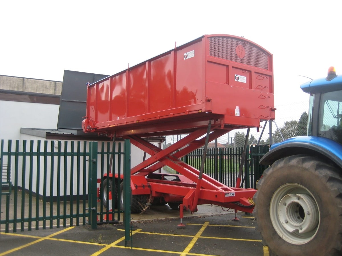 Red high tip grain trailer